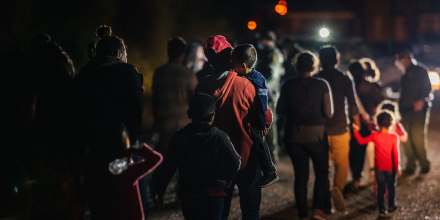 Immigrants seeking asylum walk to be taken to a Border Patrol processing facility after crossing the Rio Grande into the U.S. on June 16, 2021, in Roma, Texas. 